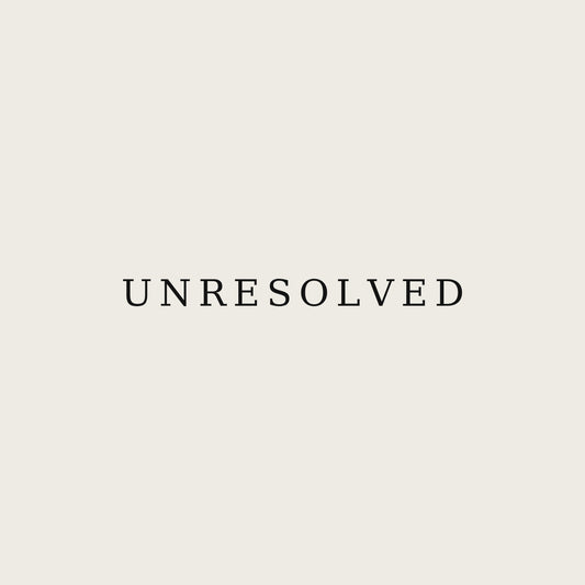 UNRESOLVED — Premium Unisex Tee — print close-up