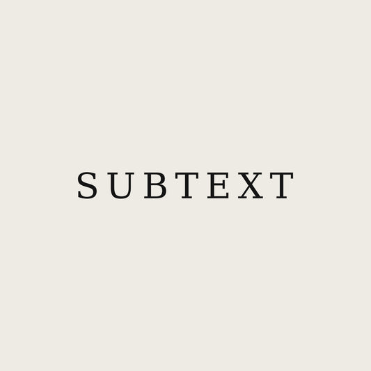 SUBTEXT — Premium Unisex Tee — print close-up