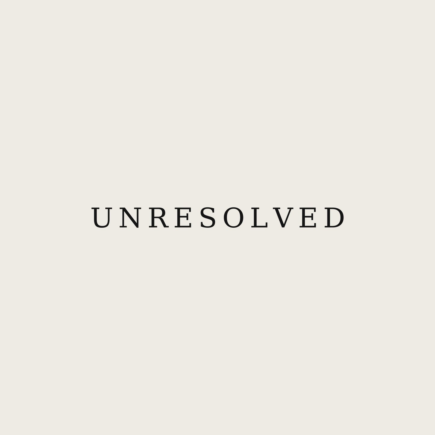 UNRESOLVED — Premium Unisex Tee — print close-up